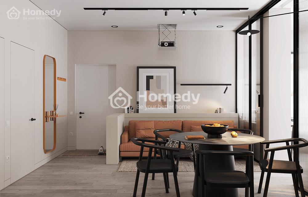 Ghế sofa màu cam và gương treo cách điệu 