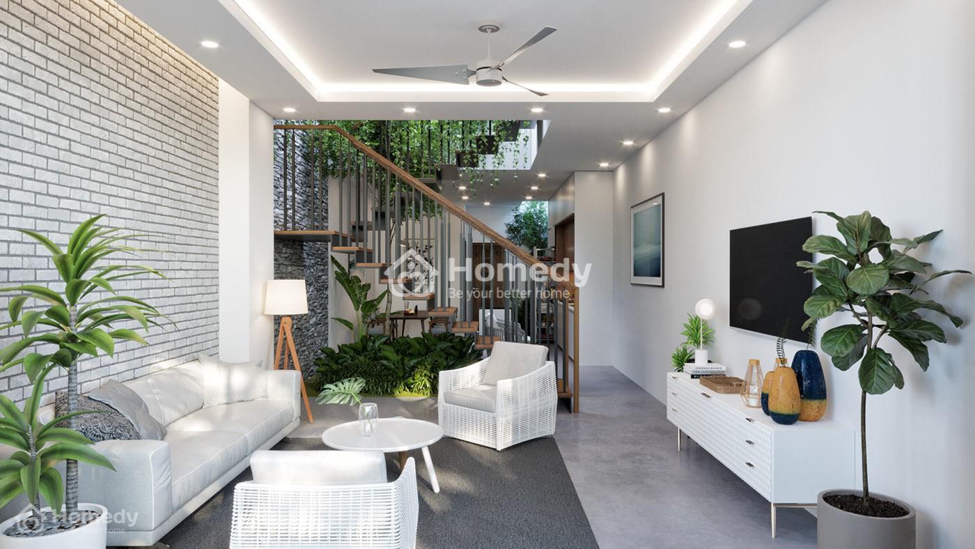 Cầu thang phòng khách nhà ống đặt ở giữa nhà để phân chia không gian